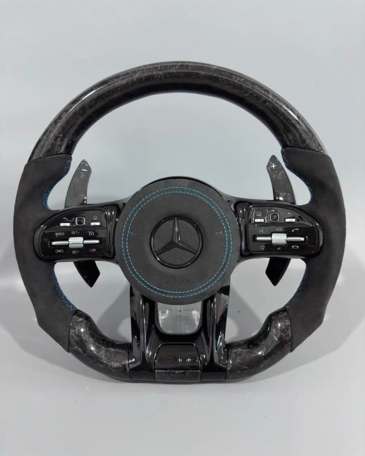 Volante Deportivo Mercedes-AMG de Carbono Forjado y Alcántara con Costura Azul, Levas y Airbag Incluido