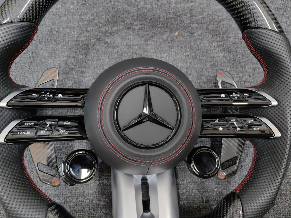 Volante Mercedes-AMG Deportivo en Carbono y Cuero Perforado | Fondo Plano, Mandos Giratorios, Levas y Airbag