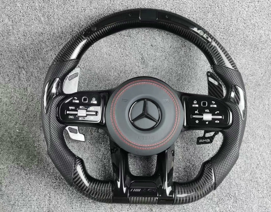 Volante Deportivo Mercedes-AMG de Carbono y Cuero Perforado con LED, Levas y Airbag Incluido