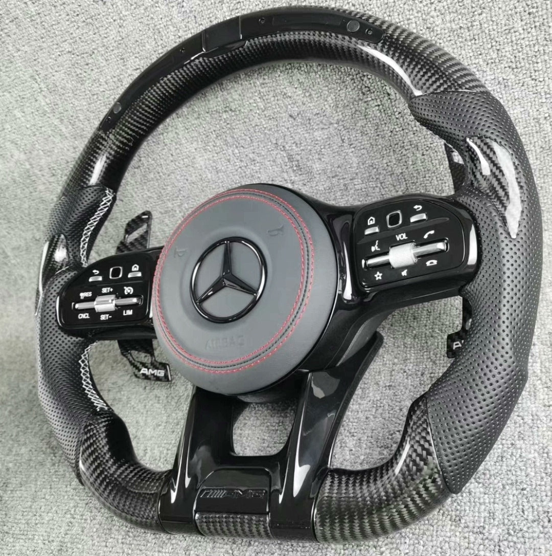 Volante Deportivo Mercedes-AMG de Carbono y Cuero Perforado con LED, Levas y Airbag Incluido