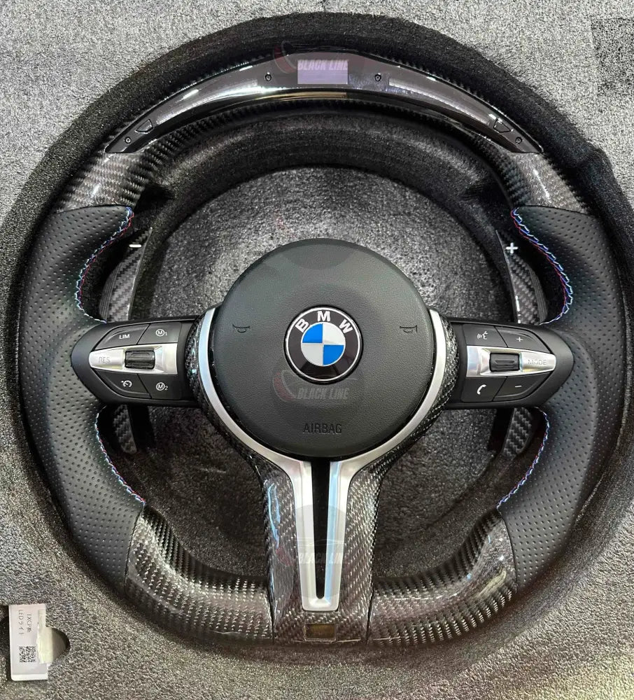 Volante BMW M Performance en Fibra de Carbono y Cuero Perforado con Race Display M1/M2 y Levas