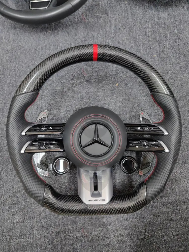 Volante Mercedes-AMG Deportivo en Carbono y Cuero Perforado | Fondo Plano Mandos Giratorios Levas y Airbag