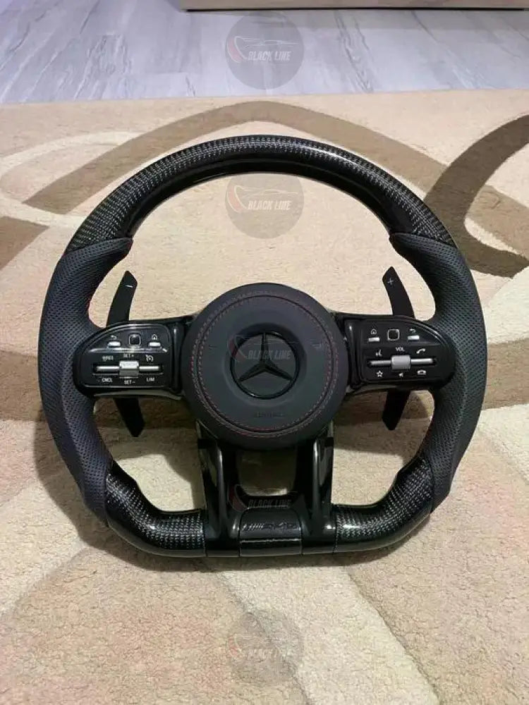 Volante Mercedes-AMG Performance en Fibra de Carbono y Cuero Perforado con Levas y Multifunción