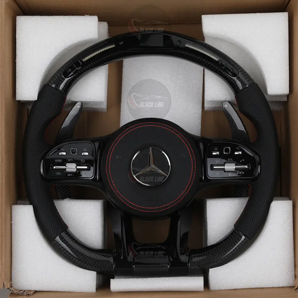 Volante Mercedes-AMG Performance en Fibra de Carbono y Cuero Perforado | Display LED Dos Levas de Carbono Multifunción