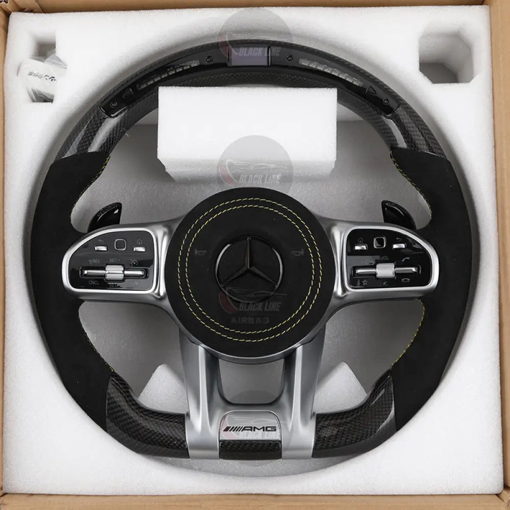 Volante Mercedes-AMG Performance en Fibra de Carbono y Microfibra con Levas Pantalla LED y Multifunción
