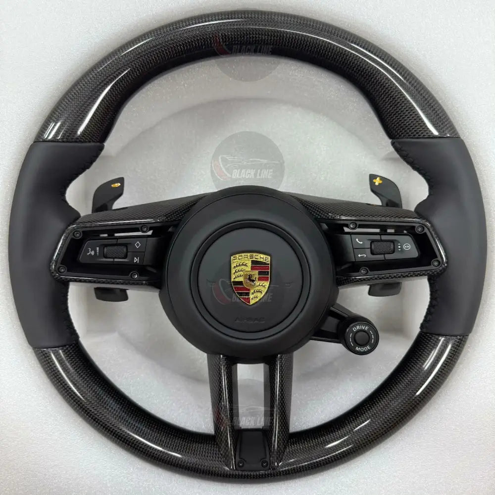 Volante Porsche Performance en Fibra de Carbono y Cuero Negro con Levas Multifunción y Drive Mode