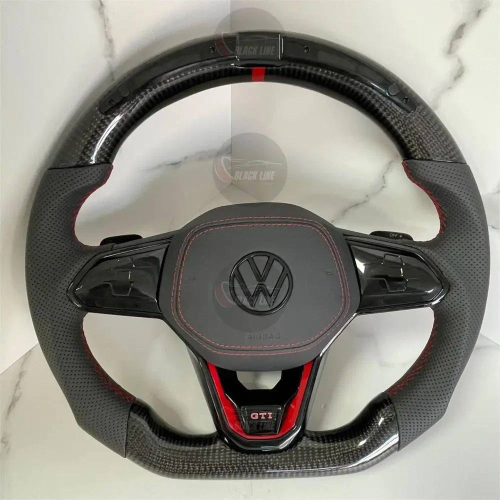 Volante Volkswagen Golf GTI Performance en Fibra de Carbono Cuero Perforado Levas y Costuras Rojas