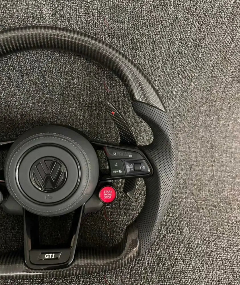 Volante Volkswagen GTI Deportivo en Fibra de Carbono y Piel Perforada | Levas de Carbono Drive Select Botón Start Fondo