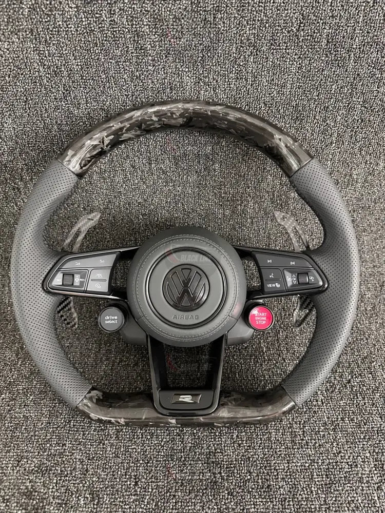 Volante Volkswagen R Deportivo en Carbono Forjado y Piel Perforada | Levas de Carbono Drive Select Botón Start Fondo