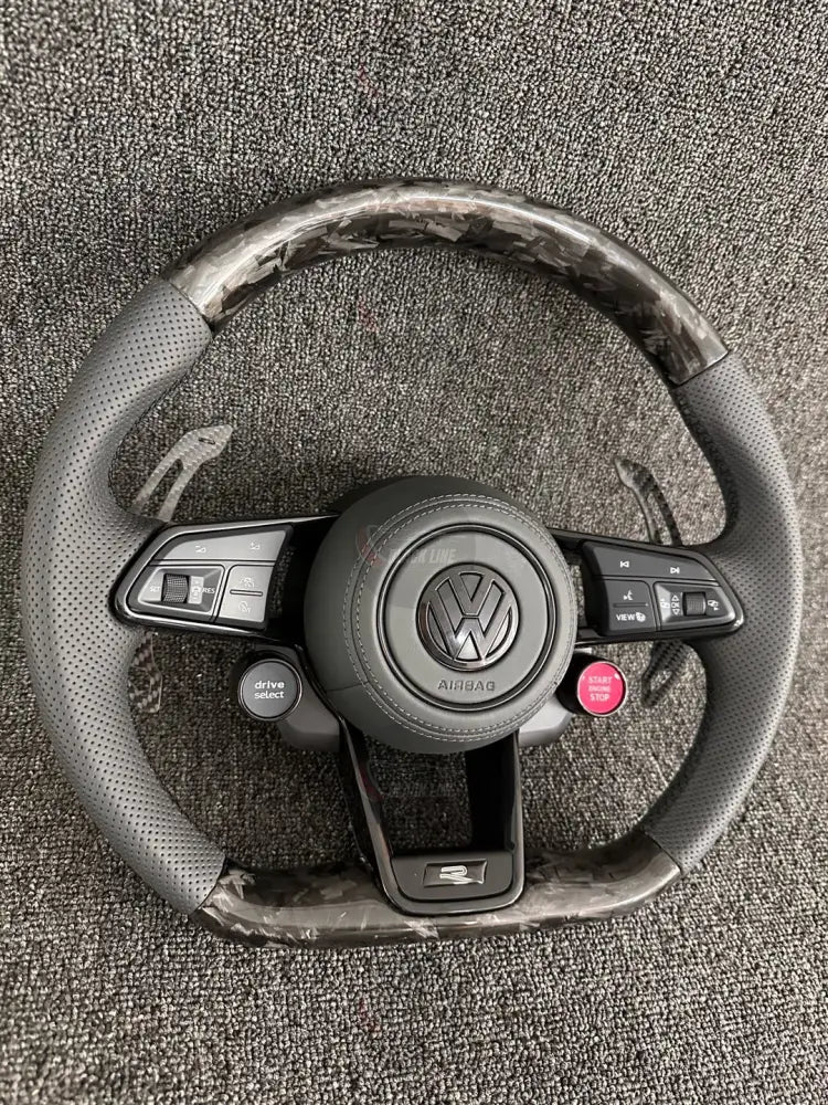 Volante Volkswagen R Deportivo en Carbono Forjado y Piel Perforada | Levas de Carbono Drive Select Botón Start Fondo